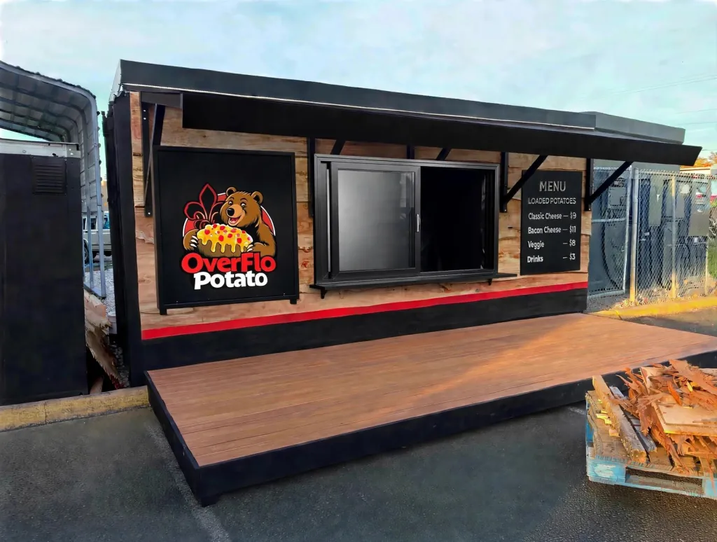 Concept of the new OverFlo Potato walk-up stand with the bear logo, service window, menu board and wooden deck