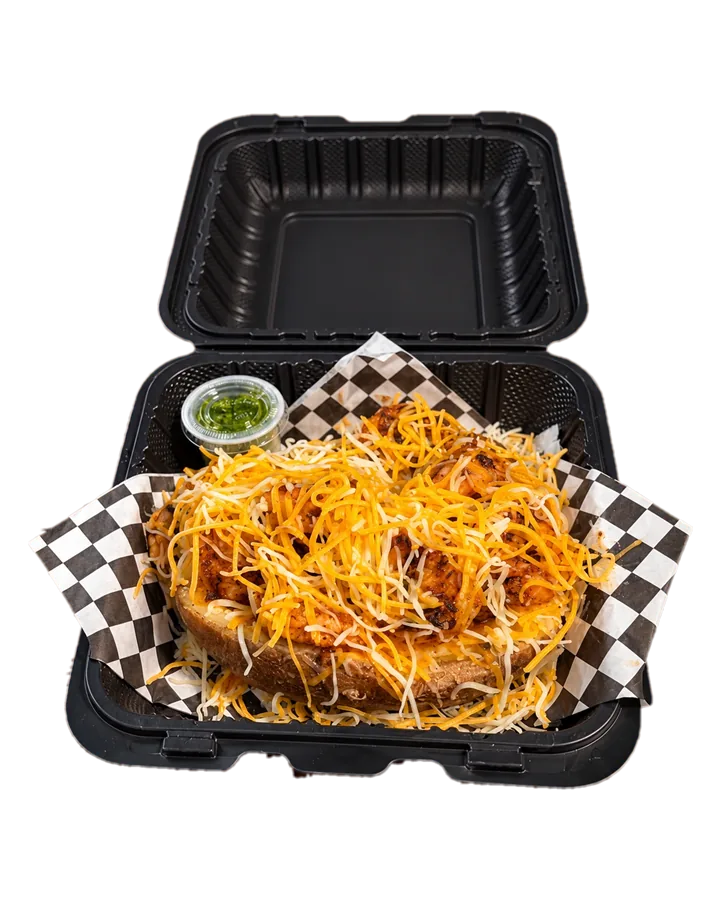 ShrimpFlo loaded potato topped with seasoned shrimp and melted cheese in a takeout box, ready for pickup