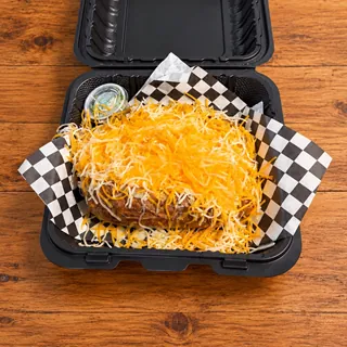 CheeseFlo loaded potato smothered in shredded cheese