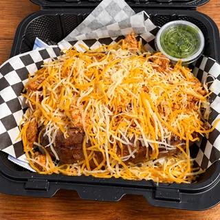 ChickenFlo loaded potato topped with seasoned chicken and shredded cheese