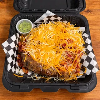 Go w/ the Flo loaded potato topped with crispy bacon and shredded cheddar