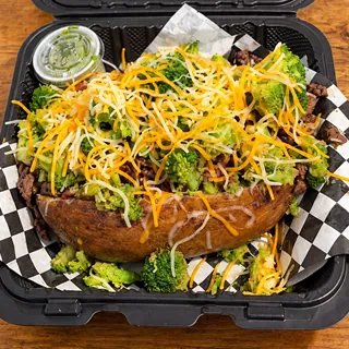 The OverFlo loaded potato topped with steak, chicken, bacon and broccoli