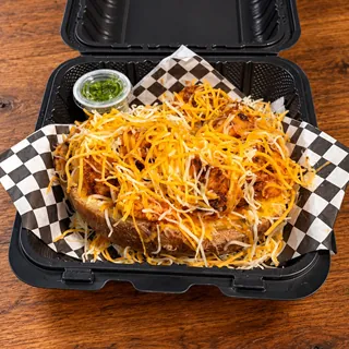 ShrimpFlo loaded potato piled with seasoned shrimp and melted cheddar