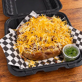 SteakFlo potato loaded with seasoned steak, bacon and cheese