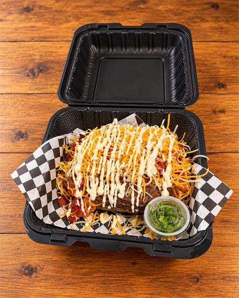C.B.R. Flo loaded potato with chicken, bacon, shredded cheese and ranch drizzle