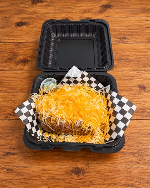 CheeseFlo loaded potato smothered in shredded cheese