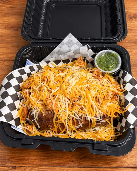 ChickenFlo loaded potato topped with seasoned chicken and shredded cheese