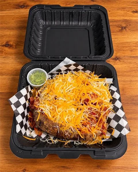 Go w/ the Flo loaded potato topped with crispy bacon and shredded cheddar