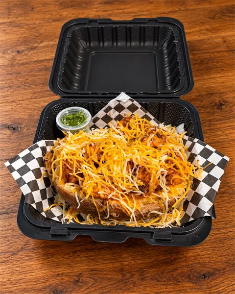 ShrimpFlo loaded potato topped with seasoned shrimp and melted cheddar